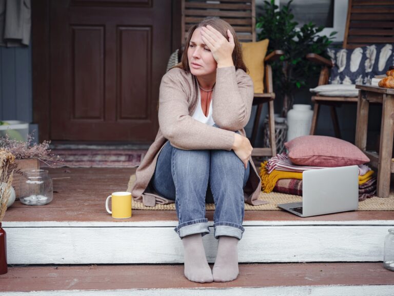 middle aged depressed woman sitting on porch 2023 11 27 04 54 57 utc